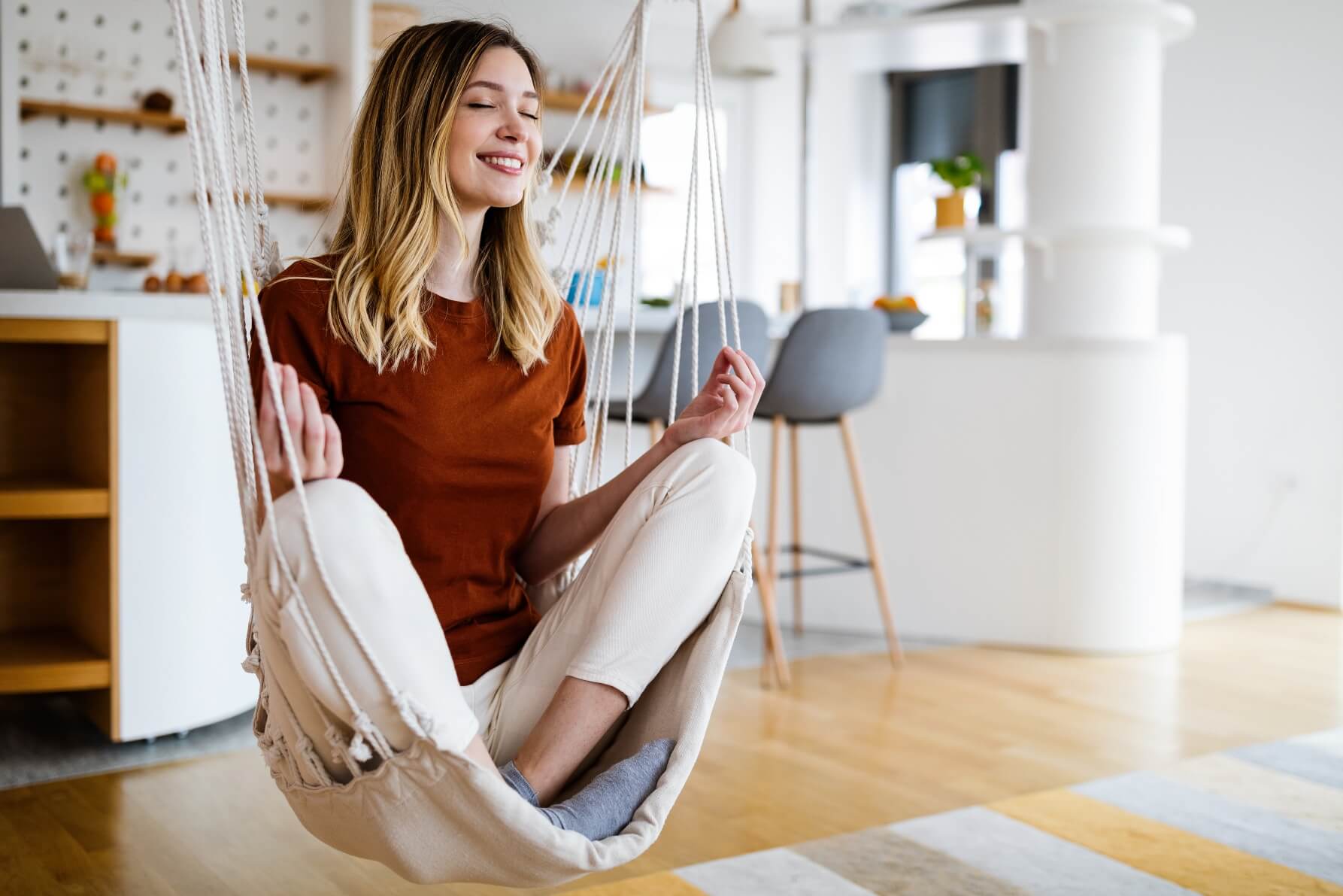 happy and smiling young woman practicing yoga medi XDM458P